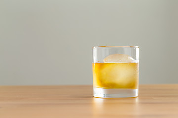 Image showing Glass of whiskey and ice