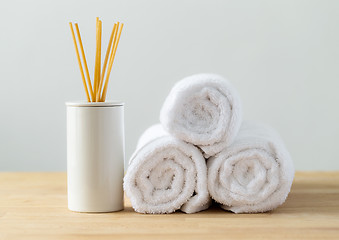 Image showing Scented woods and white towel for spa