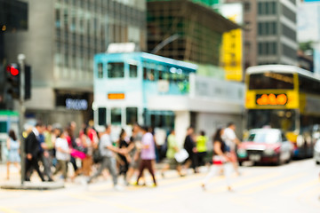 Image showing Blurred view of the pedestrian crossing the road