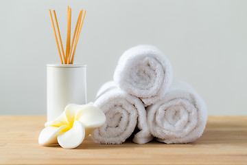 Image showing Tropical flowers frangipani with Scented woods and white towel f