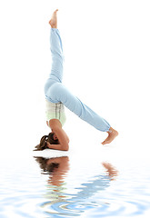 Image showing salamba sirsasana supported headstand on white sand #3