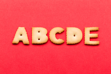 Image showing ABCDE cookie over the red background
