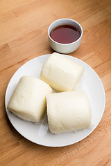 Image showing Steamed chinese bun and a cup of tea