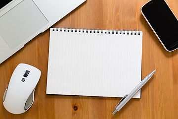 Image showing Office table with empty handbook for advertising