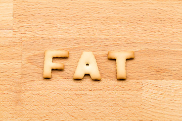 Image showing Word fat cookie over the wooden background