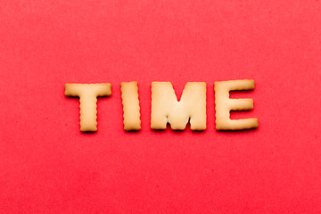 Image showing Word time biscuit over the red background