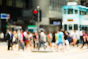 Image showing Blurred view of the people crossing the road