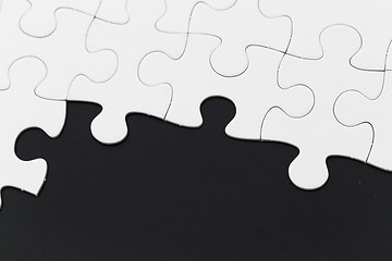Image showing Plain puzzle on black background