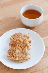 Image showing Japanese fish-shaped cake with a cup of tea