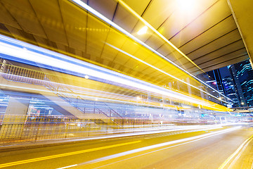 Image showing Fast moving car at night in modern city