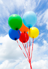 Image showing Bunch of colorful balloons in blue sky