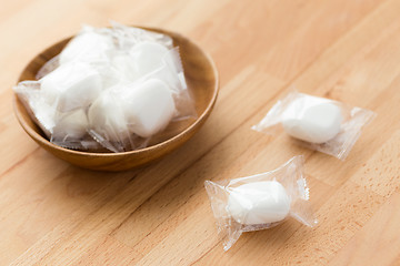 Image showing Marshmallow in wooden bowl on wooden table