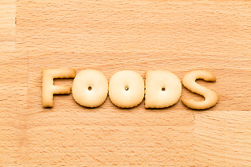 Image showing Word foods biscuit over the wooden background
