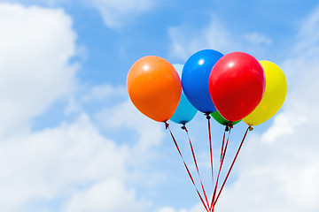 Image showing Bunch of colorful balloons in blue sky