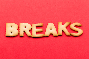 Image showing Word breaks biscuit over the red background