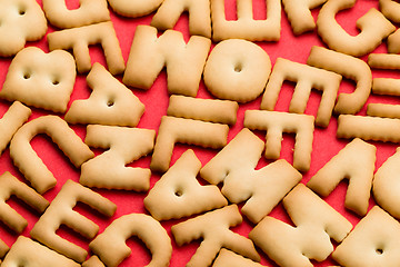 Image showing Assorted word cookie over red background
