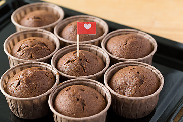 Image showing Chocolate muffins with small flag of love