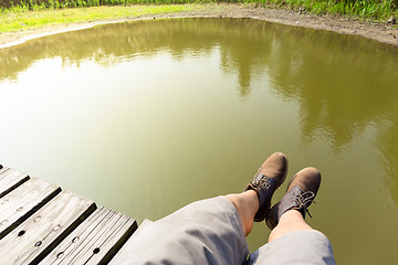 Image showing Man legs with lake