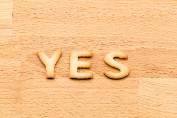 Image showing Word yes cookie over the wooden background