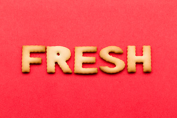 Image showing Word fresh cookie over the red background