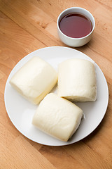 Image showing Chinese steamed bun with a glass of tea