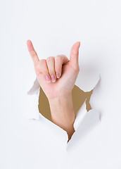 Image showing Six finger breaking through paper wall