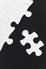 Image showing White puzzle on the table