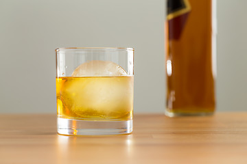 Image showing Glass and bottle of whiskey