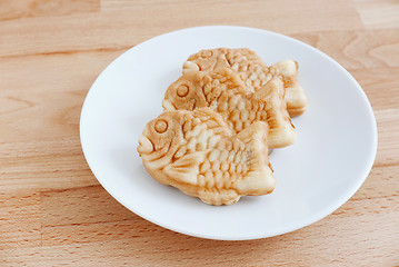 Image showing Taiyaki of japanese traditional baked sweets on wooden table