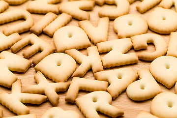 Image showing Baked text biscuit over the wooden table