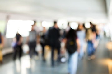 Image showing Blur bokeh of footbridge with crowded pedestrian