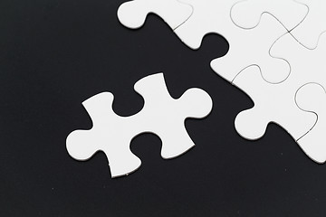 Image showing Plain puzzle over black background