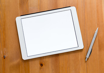 Image showing Digital Tablet and pen on a desk and presenting a blank screen f