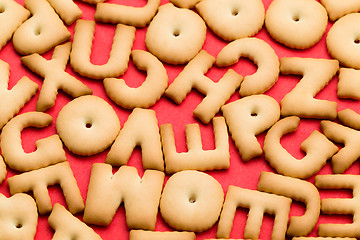 Image showing Assorted word biscuit over red background