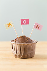 Image showing Chocolate muffins with small flag of a word mon