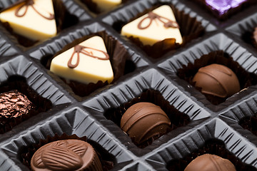 Image showing A box of various chocolate pralines