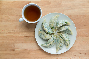 Image showing Meat dumpling with a cup of tea