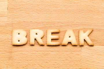 Image showing Word break cookie over the wooden background