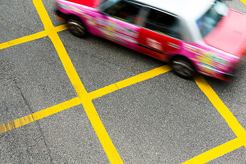 Image showing Blurred picture of Taxi speeding up in Hong Kong