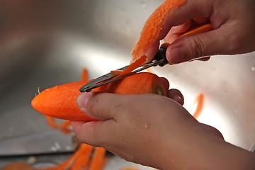 Image showing Peeling carrot