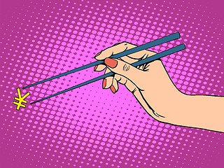 Image showing The Japanese yen and chopsticks