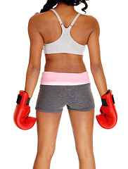 Image showing Athletic woman wearing boxing gloves.
