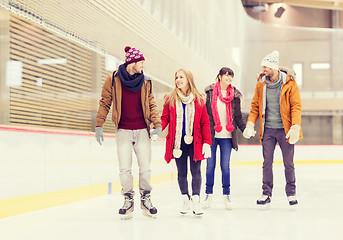 Image showing happy friends on skating rink