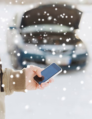 Image showing closeup of man with broken car and smartphone