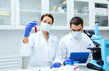 Image showing young scientists making test or research in lab