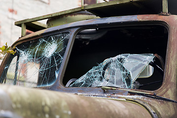 Image showing war truck with broken windshield glass outdoors