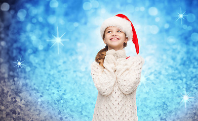 Image showing dreaming girl in santa helper hat