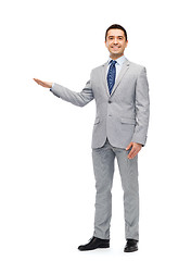 Image showing happy smiling businessman in suit