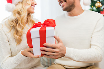 Image showing close up of couple with christmas gift at home