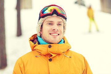 Image showing happy young man in ski goggles outdoors